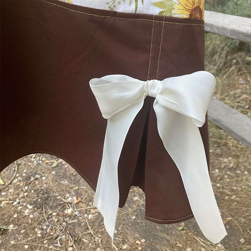 sunflower 20s apron-kick-pleat detail